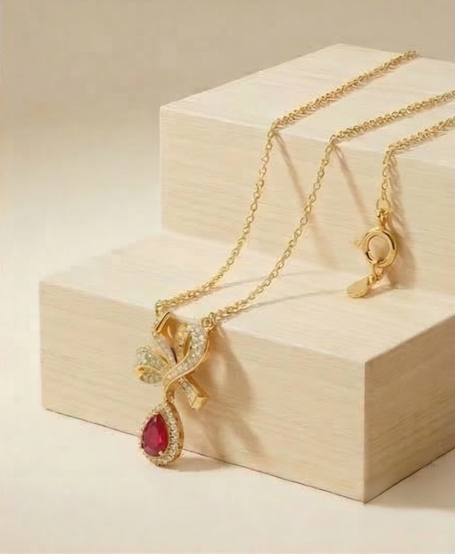 925 Sterling Silver Ribbon Bow Pendant Necklace Jewellery with Red Stone in Gold Plated Finish